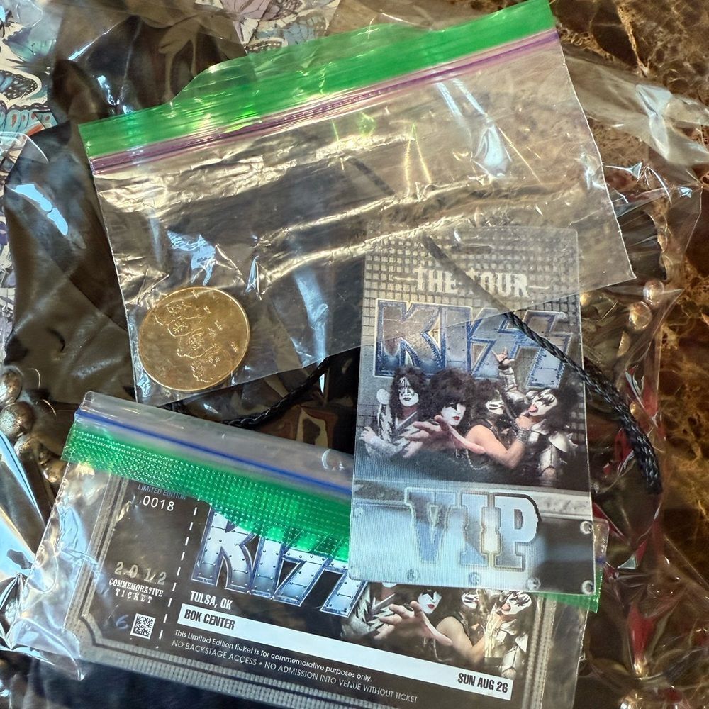 Kiss VIP Tour Memorabilia with Silver and Green Accents